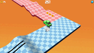 Green car driving from a blue checkered track onto a pink section in Drift Boss